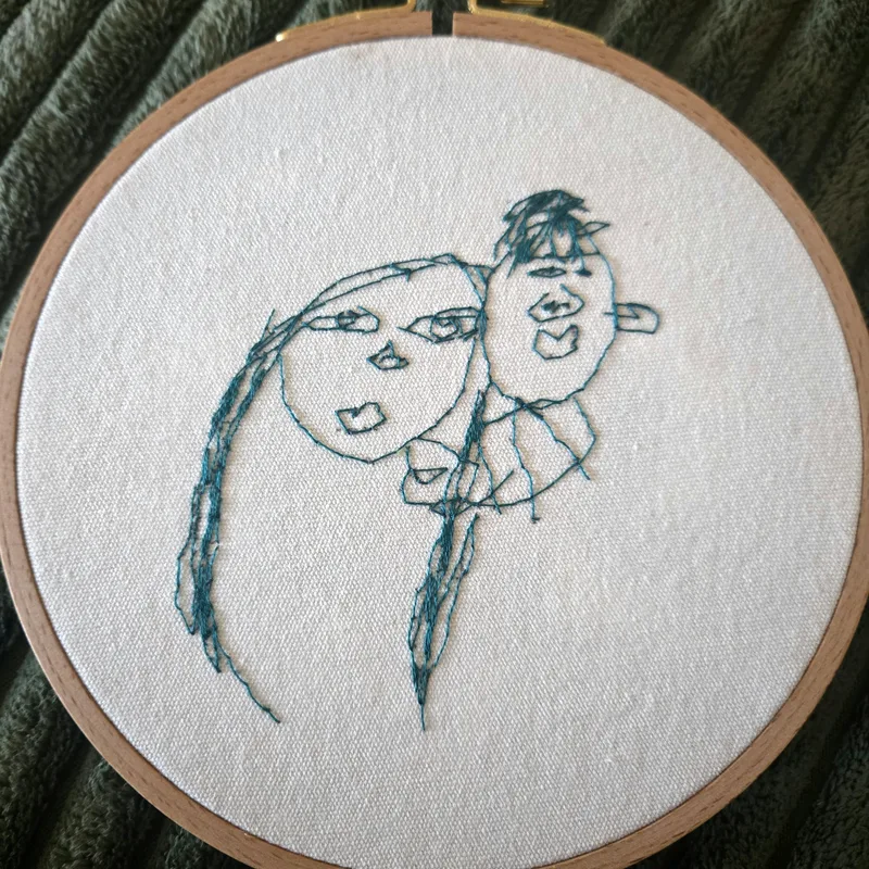 Child's portrait drawing hand-embroidered into an embroidery hoop keepsake