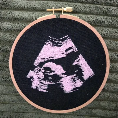 Ultrasound embroidery hoop on black fabric